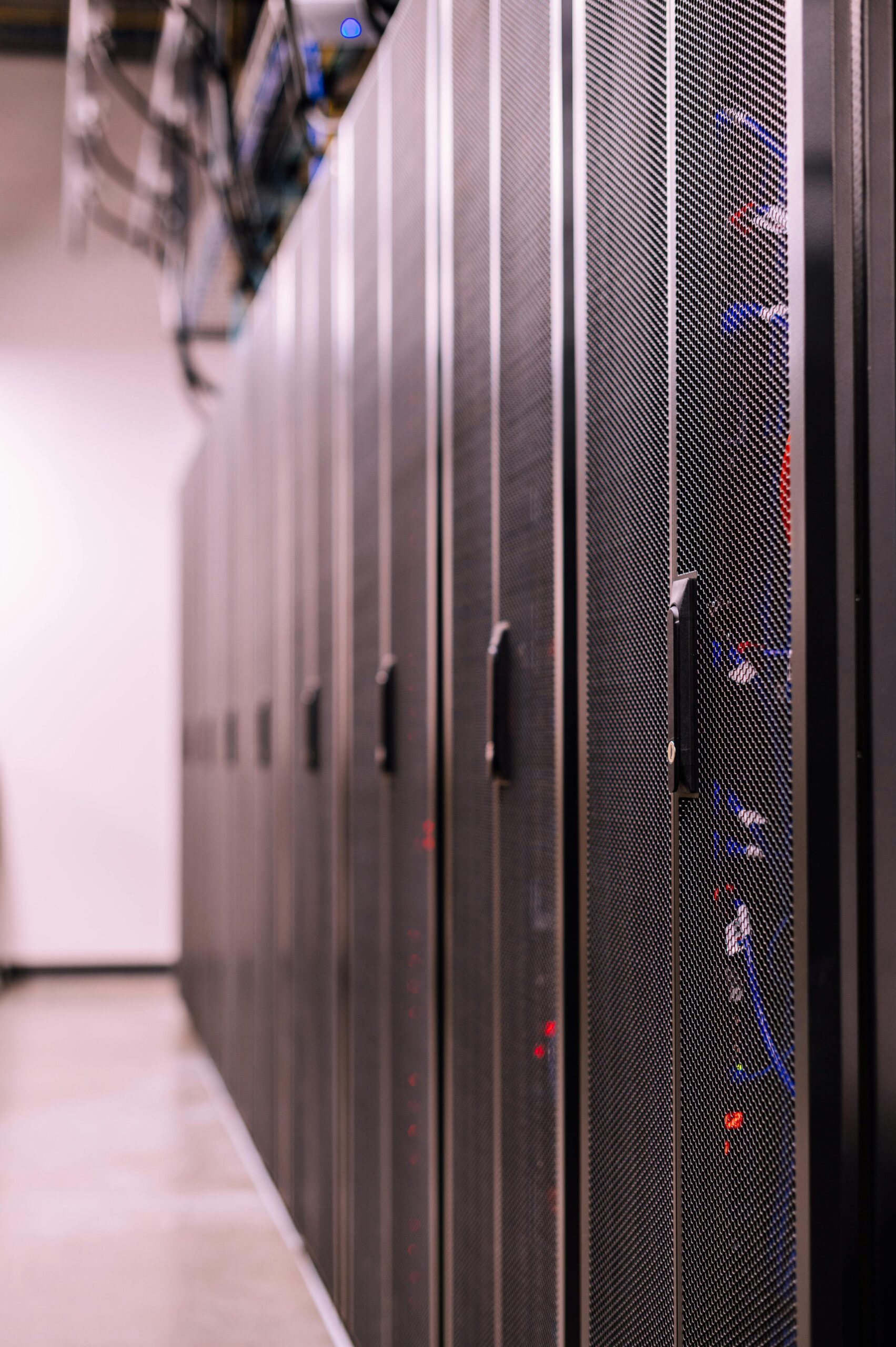 Detailed view of network server racks in a modern data center, highlighting technology infrastructure.